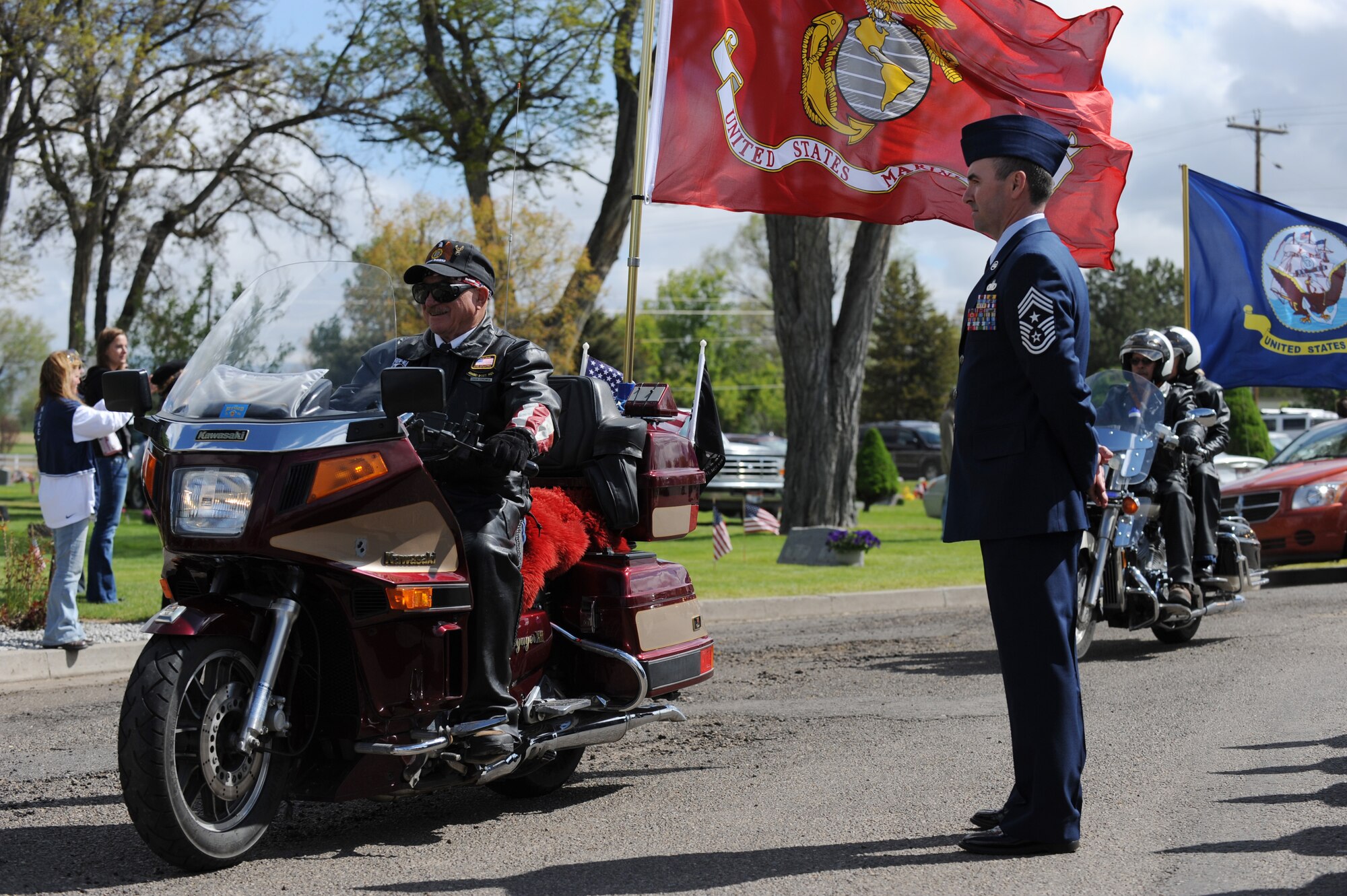 MOUNTAIN HOME, Idaho – Command Chief Master Sgt. Ronald McCarthy stands at attention while members of the Legion Riders pass with each branches’ flag during a Memorial Day ceremony at Mountain View Cemetery here May 30. Speakers included Col. Ron Buckley, 366th Fighter Wing Commander, Mayor Tom Rist, American Legion Post 26 Commander Rich McMahan Jr. and Chaplain Jime Blanton. (U.S. Air Force photo by Staff Sgt. Gina Chiaverotti-Paige) 