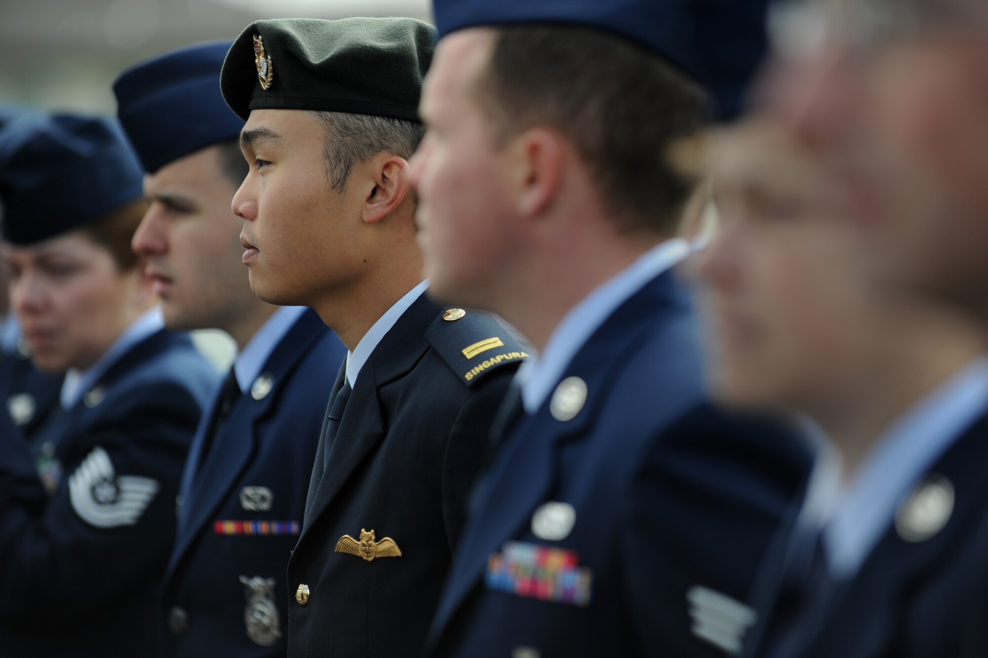 MOUNTAIN HOME, Idaho – U.S. Air Force and Republic of Singapore air force members stand in formation during a Memorial Day ceremony at the Mountain View Cemetery here May 30. Active duty, guardsmen and veterans from all branches came out to honor military heroes both past and present. (U.S. Air Force photo by Staff Sgt. Gina Chiaverotti-Paige) 