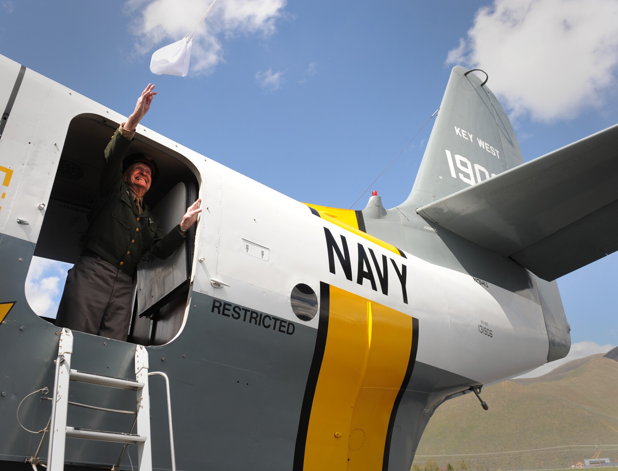 HAILEY, Idaho -- Retired U.S. Air Force Col. Gail Halvorsen throws a parachute with candy attached to it out of a Grumman HU-16 Albatross here May 26. Colonel Halvorson is well known as the “candy bomber” for dropping candy during the Berlin Airlift. (U.S. Air Force photo by Staff Sgt. Gina Chiaverotti-Paige) 
