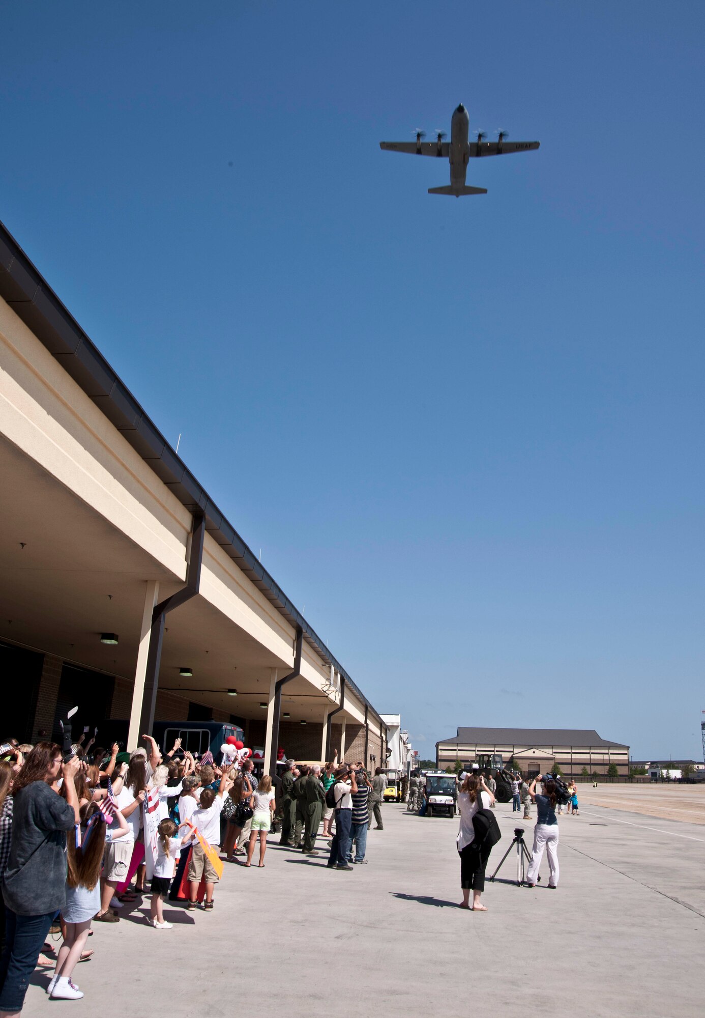 Two C-130J-30s carrying members of the 403rd Wing and 815th and 345th Airlift Squadrons flew over the Roberts Maintenance Building May 19.  The group returned to Keesler Air Force Base, Miss. from Afghanistan after deploying nearly 50 airmen in January.  