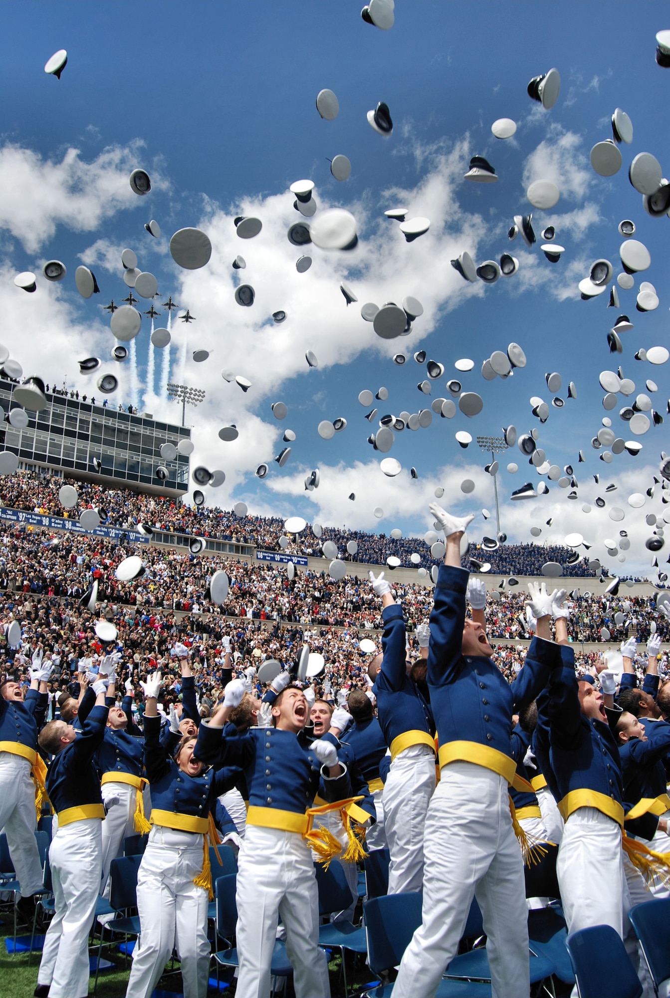 U.S. AIR FORCE ACADEMY, Colo. – Newly commissioned second lieutenants celebrate at the end of the Air Force Academy's Class of 2011 graduation ceremony May 25, 2011. Flying overhead are F-16 Fighting Falcons with the Thunderbirds U.S. Air Force Aerial Demonstration Squadron. Secretary of the Air Force Michael B. Donley was there to congratulate the 1,021 graduates as guest speaker for the commencement. (U.S. Air Force photo/ Airman 1st Class Jessica Hines)