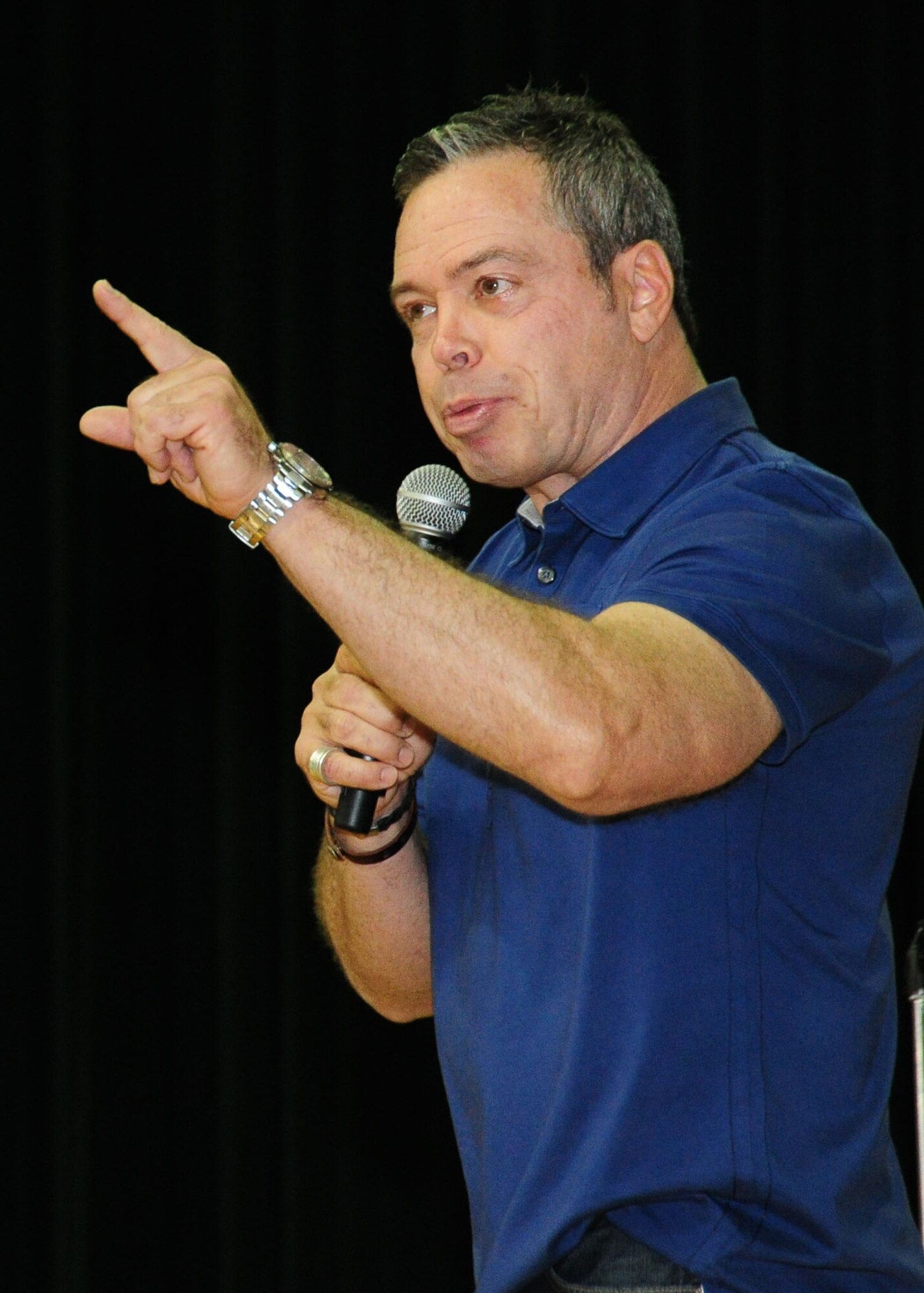 Comedian Bernie McGrenahan delivered a safety message to servicemembers at the Joint Base Andrews Theater here May 26. His message centered on his own life experiences with alcohol, drugs and suicide, passing his very serious message through comedy. (U.S. Air Force photo/ Staff Sgt. Nichelle Anderson)