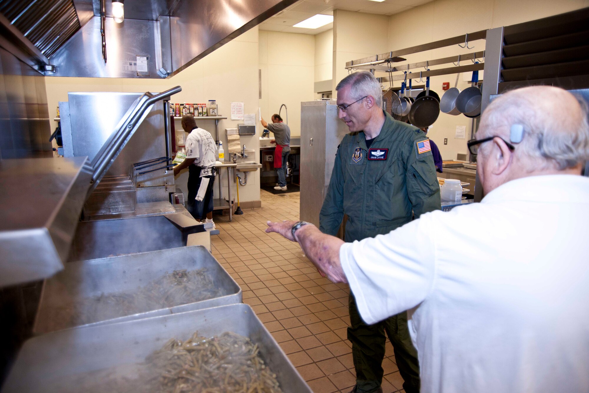 Wayne Favre, director of Feed My Sheep, gives Col. Craig LaFave, 403rd Wing vice commander, a tour of the non-profit organization dedicated to feeding the community's needy.  Colonel LaFave visited the Gulfport, Miss., organization May 19 with Master Sgt. Chasity Roush, 815th Airlift Squadron, and Chaplain (Maj.) Ray Thompson, 403rd Wing chaplain.  Sergeant Roush's church held a food drive for Feed My Sheep earlier in the month.