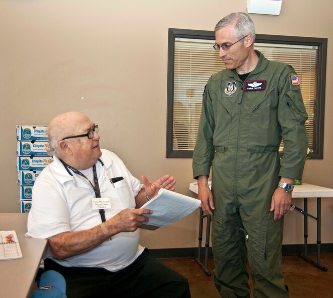 Col. Craig LaFave, 403rd Wing vice commander, converses with Wayne Favre, director of Feed My Sheep, which is a non-profit organization dedicated to feeding the community's needy. Colonel LaFave visited the Gulfport, Miss., organization May 19 with Master Sgt. Chasity Roush, 815th Airlift Squadron, and Chaplain (Maj.) Ray Thompson, 403rd Wing chaplain. Sergeant Roush's church held a food drive for Feed My Sheep earlier in the month. (U.S. Air Force photo by Tech, Sgt. Tanya King) 


