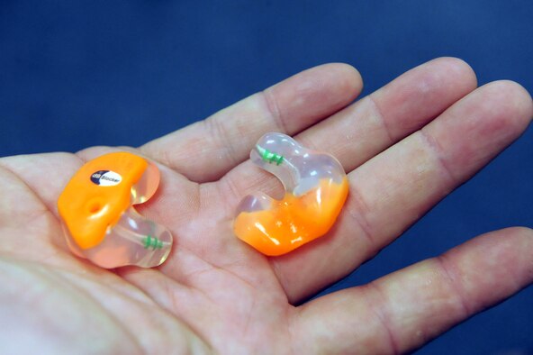 The custom-molded earplugs offer better noise reduction than other models but still allow the human voice to be heard. U. S. Air Force photo by Ray Crayton