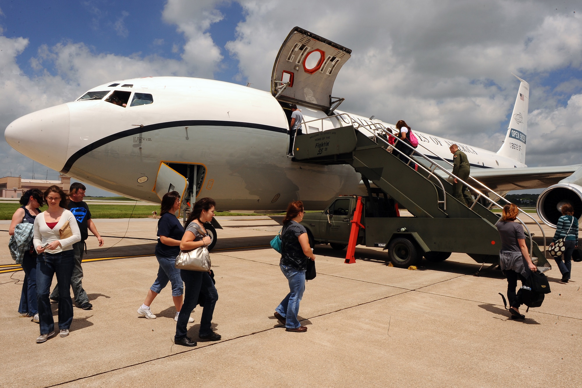 OFFUTT AIR FORCE BASE, Neb. - 45th Reconnaissance Spouses board the OC-135B Open Skies aircraft, as part of an incentive flight, here, May 21. Forty seats on two separate flights were reserved for the spouses of 45th RS Airmen in order for them to get a first hand look at their spouse's daily operations.  The OC-135B routinely travels across Russia and many other Open Skies Treaty signatory nations photographing areas of interest to the Defense Threat Reduction Agency.
U.S. Air Force Photo by Josh Plueger (released)
