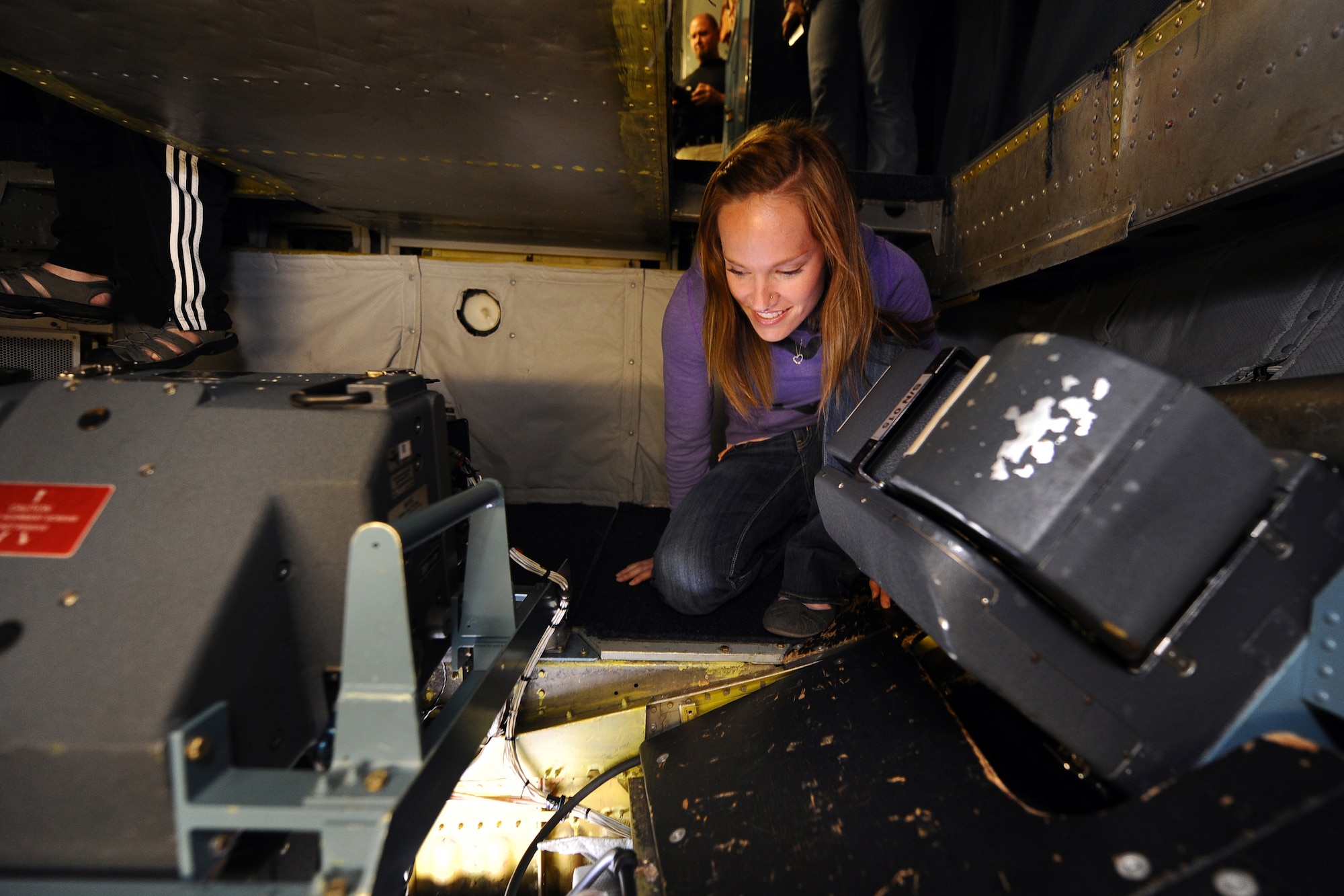 OFFUTT AIR FORCE BASE, Neb. - Keelah Wagoner, wife of 1st Lt Brandon Wagoner, peers through the floor glass on the tail of an OC-135B Open Skies aircraft as part of an incentive flight here May 21. Forty seats on two separate flights were reserved for the spouses of 45th RS Airmen in order for them to get a first hand look at their spouse's daily operations.  The OC-135B routinely travels across Russia and many other Open Skies Treaty signatory nations photographing areas of interest to the Defense Threat Reduction Agency.

U.S. Air Force Photo by Josh Plueger (released)