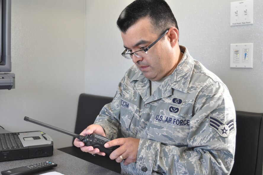 Senior Airman Joel Aspeytia, 452nd Emergency Management Flight, adjusts a radio during the 3rd Annual Riverside County Multi-Agency Communication Interoperability Test at the Ben Clark Training Center in Riverside, Calif., May 19, 2011.  The test, nicknamed "Radio Rodeo," ensures city, county, state and federal first responder agencies will be able to work together during a major disaster.  (U.S. Air Force photo/ Megan Just)