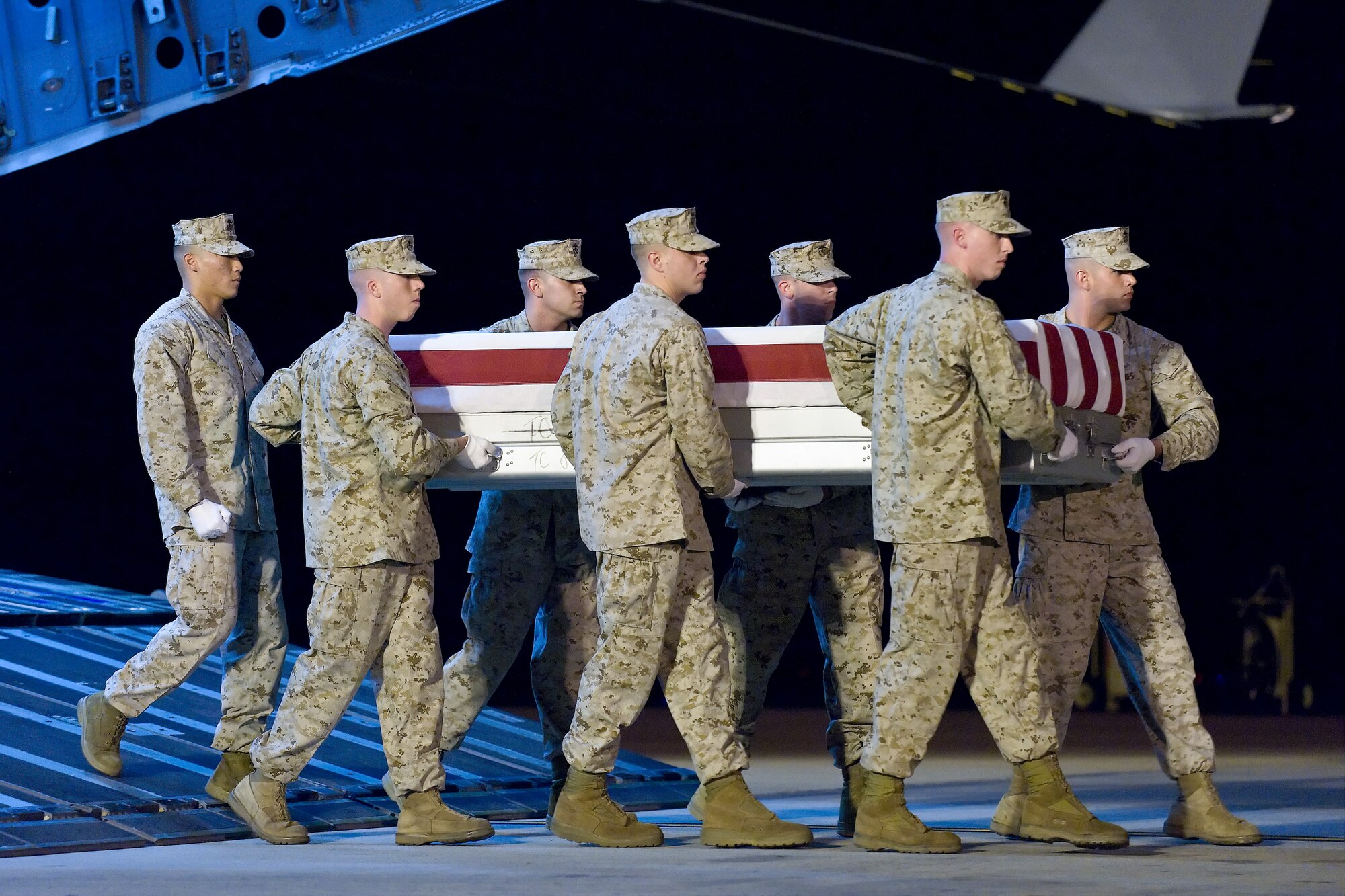 A U.S. Marine Corps carry team transfers the remains of Marine Lance Cpl. Peter J. Clore, of New Philadelphia, Ohio, at Dover Air Force Base, Del., May 31, 2011. Clore was assigned to 3rd Battalion, 2nd Marine Regiment, 2nd Marine Division, II Marine Expeditionary Force, Camp Lejeune, N.C. (U.S. Air Force photo/Roland Balik)