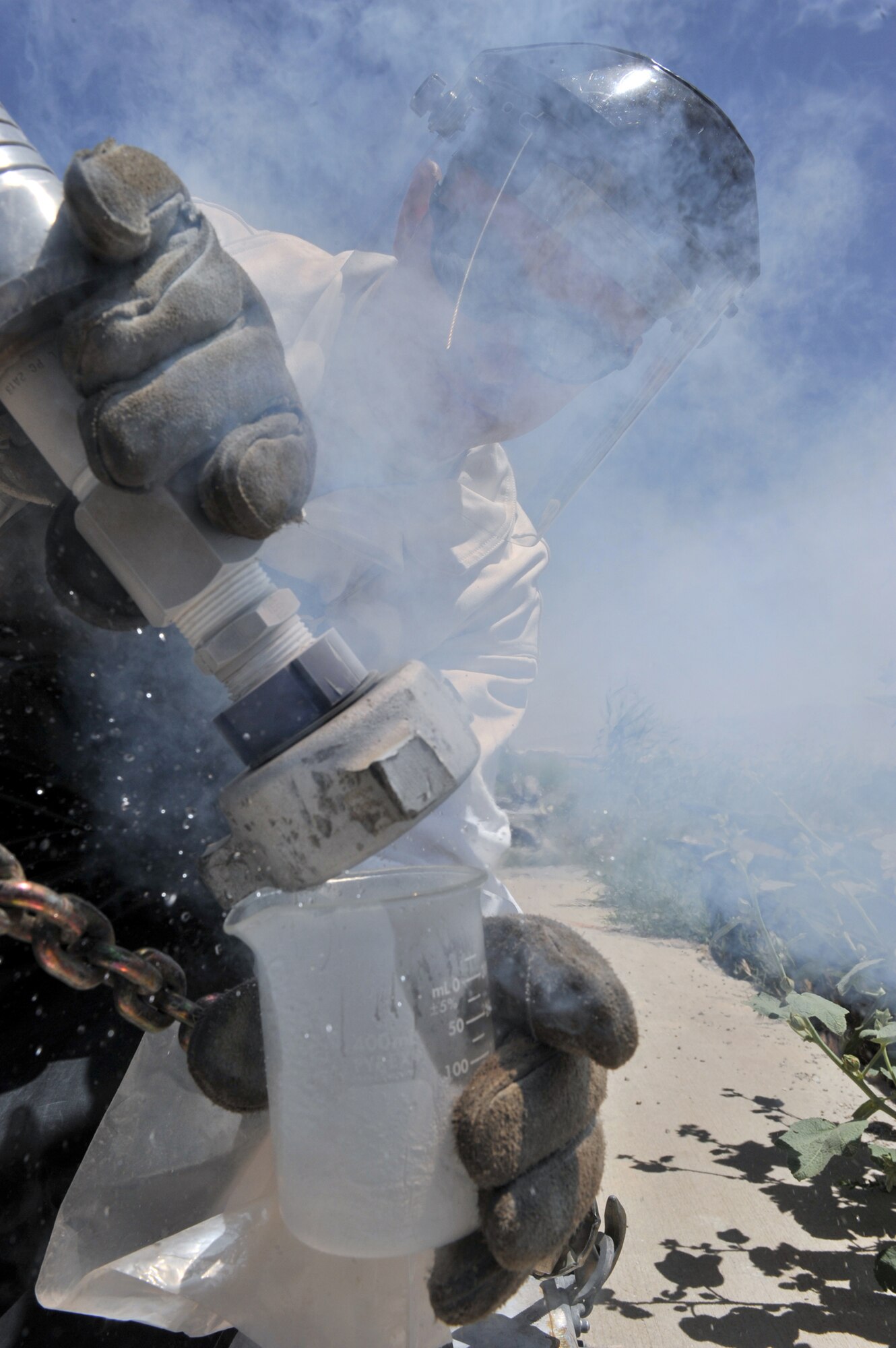 Staff Sgt. William Veal samples liquid nitrogen May 20, 2011, at Bagram Airfield, Afghanistan. Cryogenics supplies liquid oxygen and nitrogen which service the F-16 Strike Eagles. Sergeant Veal is a 455th Expeditionary Logistics Readiness Squadron cryogenic technician. (U.S. Air Force photo/Senior Airman Sheila deVera)
