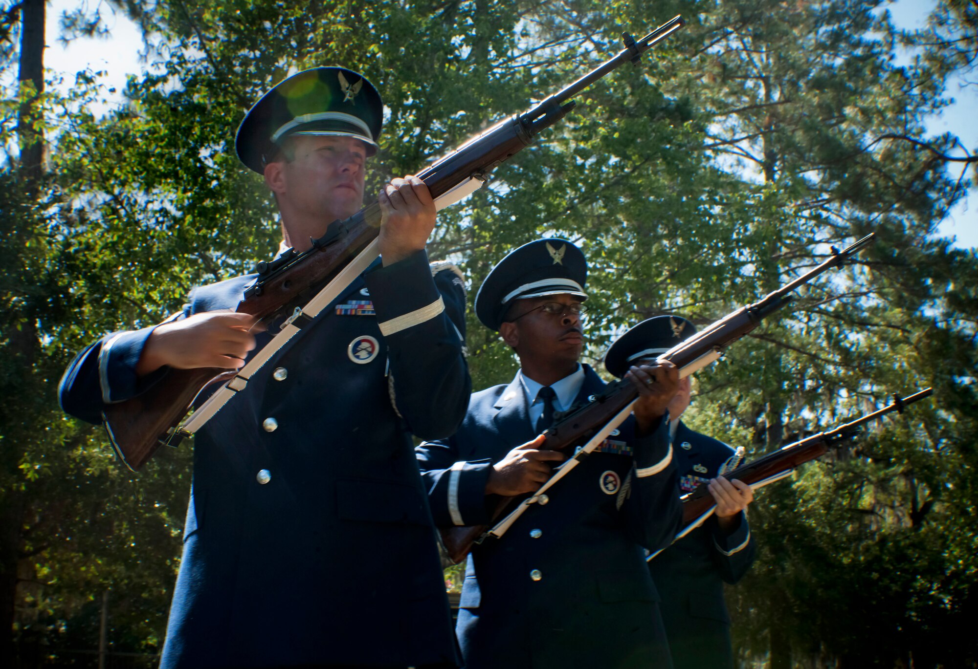 Members of the Moody Air Force Base Honor Guard render a three-volley rifle salute during a Memorial Day ceremony at the Sunset Hill Cemetery in Valdosta, Ga., May 30.  The three-volley rifle salute honored those that gave the ultimate sacrifice. (U.S. Air Force photo/Senior Airman Benjamin Wiseman)(RELEASED)