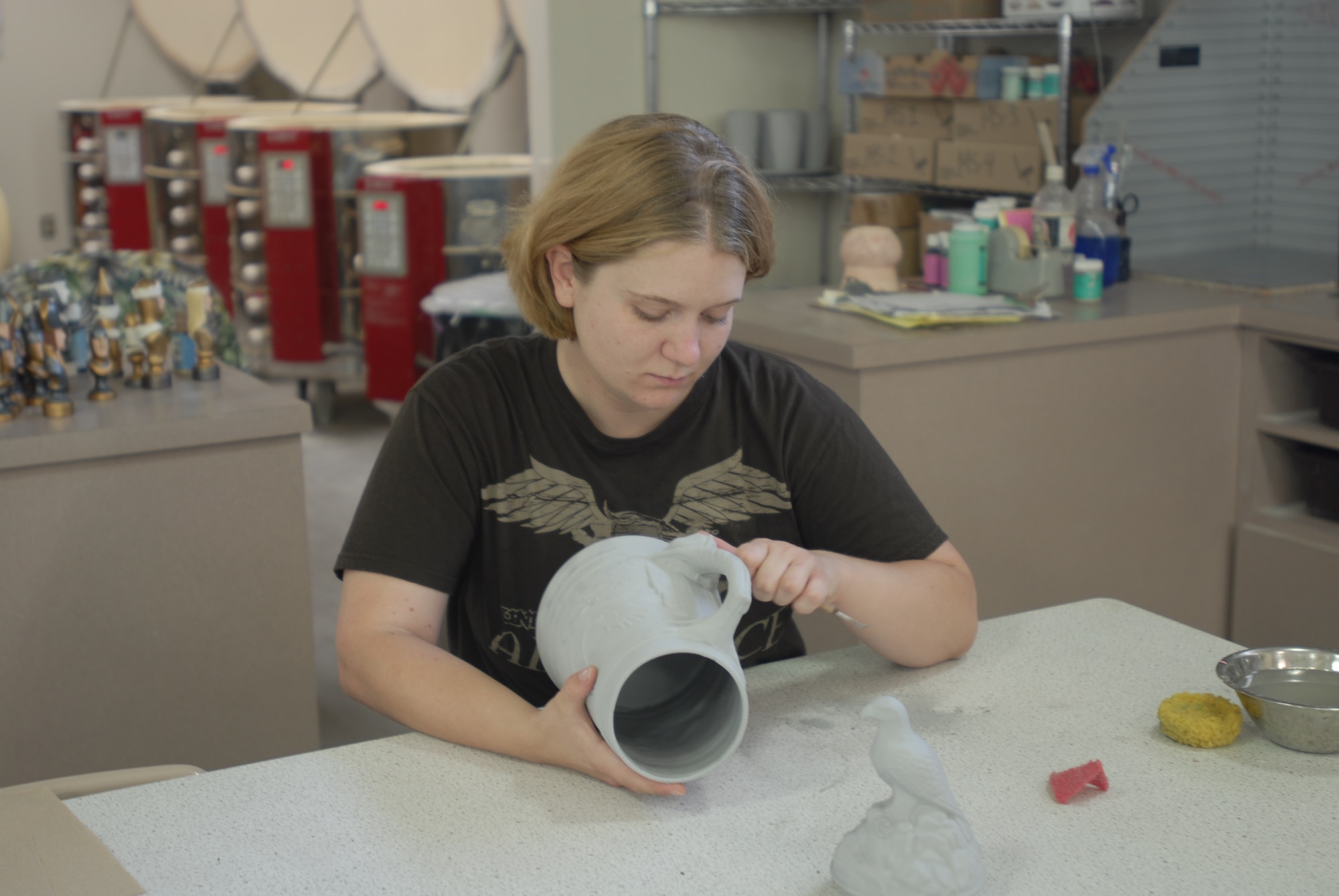 GOODFELLOW AIR FORCE BASE, Texas—Airman 1st Class Jessica Keith, 17th Training Wing Public Affairs, prepares a ceramic stein, a decorative German beer mug, for firing May 21. Firing is the one of the first steps when preparing a ceramic for painting. (U.S. Air Force photo) 