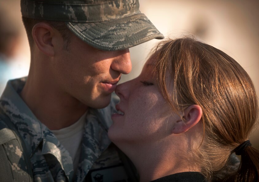MOODY AIR FORCE BASE, Ga.-- Senior Airman Cameron Ellis, 822nd Base Defense Squadron fire team member, and his wife Sara embrace before deploying to Iraq in support of Operation New Dawn. Airman Ellis and his wife have been married more than a year and they’ll be experiencing their second deployment. (U.S. Air Force photo/Airman 1st Class Joshua Green)(RELEASED)