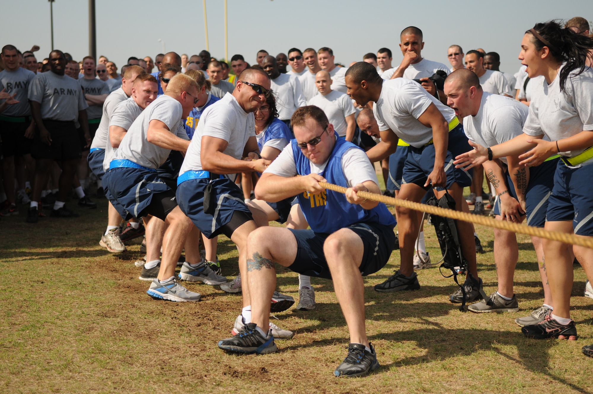 GOODFELLOW AIR FORCE BASE, Texas -- Senior Airman James Lowe, an instructor from the 315th Training Squadron, leads his unit's team in tug-of-war May 27. Team Goodfellow devoted the day to safety and sports to kick off the 101 critical days of summer. (U.S. Air Force photo/Staff Sgt. Heather L Rodgers)