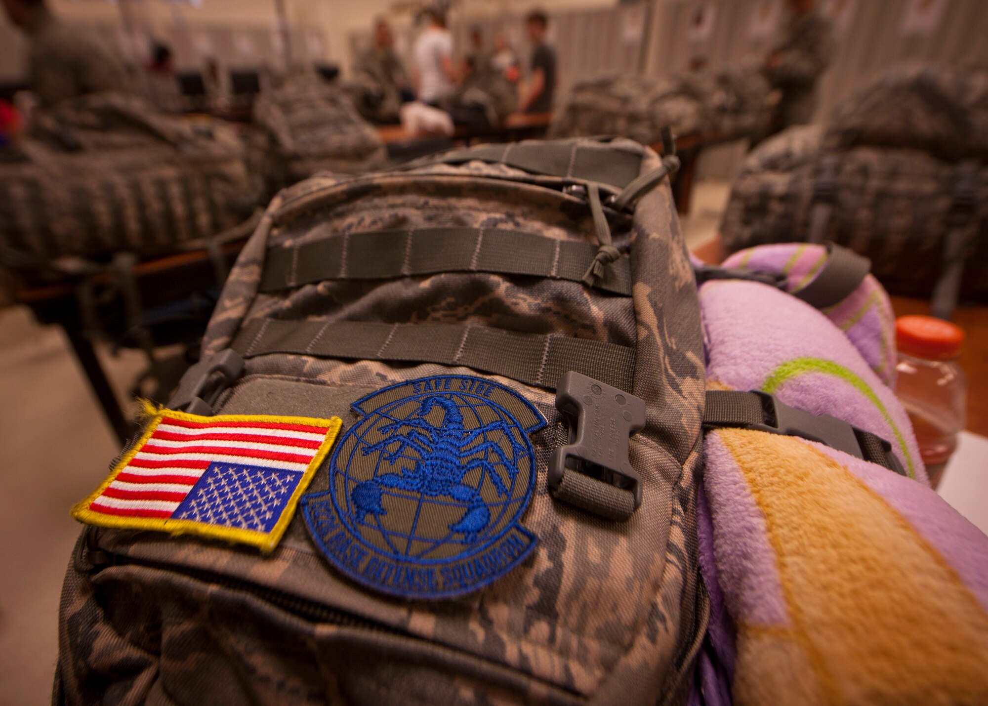 MOODY AIR FORCE BASE, Ga.-- The American flag and the 822nd Base Defense Squadron patch is placed on a deployment bag. Airmen from the 822nd BDS left for a six-month deployment supporting Operation New Dawn in Iraq. (U.S. Air Force photo/Airman 1st Joshua Green)(RELEASED)
