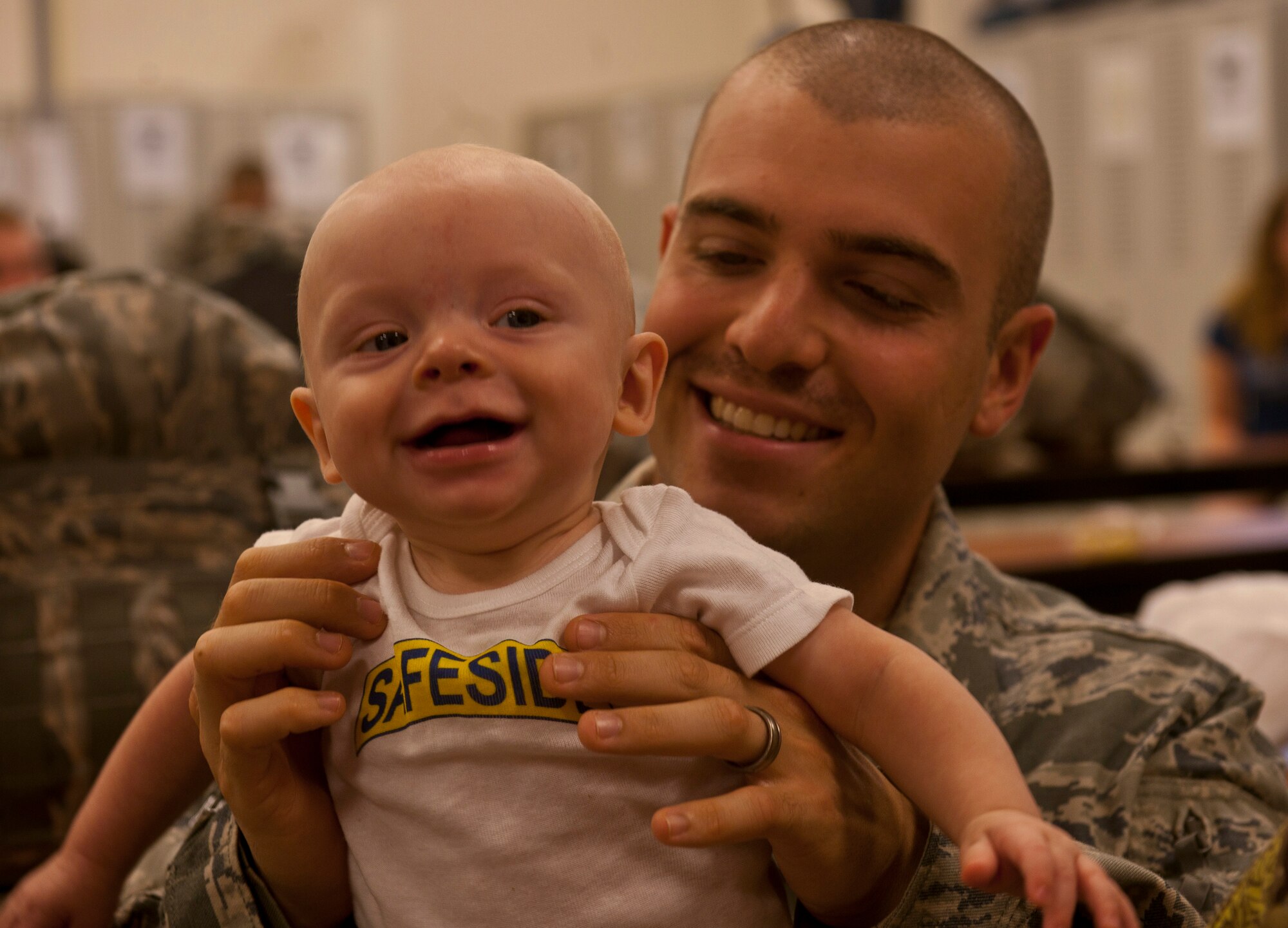 MOODY AIR FORCE BASE, Ga.-- Senior Airman Lee Lanthorn, 822nd Base Defense Squadron fire team member, plays with his son Silas before recently deploying. Because Airman Lanthorn would miss Silas’s birthday due to his deployment, he and his wife celebrated earlier in the week. (U.S. Air Force photo/Airman 1st Joshua Green)(RELEASED)
