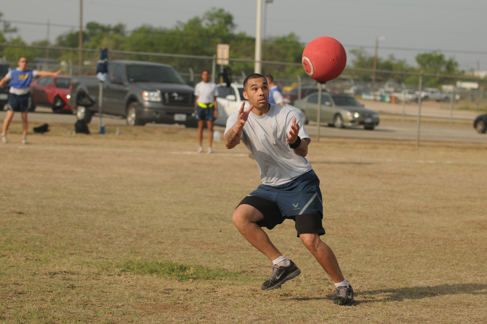 GOODFELLOW AIR FORCE BASE, Texas -- Senior Airman Jamie Brudette, a customer service technician from the 17th Force Support Squadron, catches the ball during a kickball game May 27. Team Goodfellow devoted the day to safety and sports to kick off the 101 critical days of summer. (U.S. Air Force photo/Staff Sgt. Heather L Rodgers)