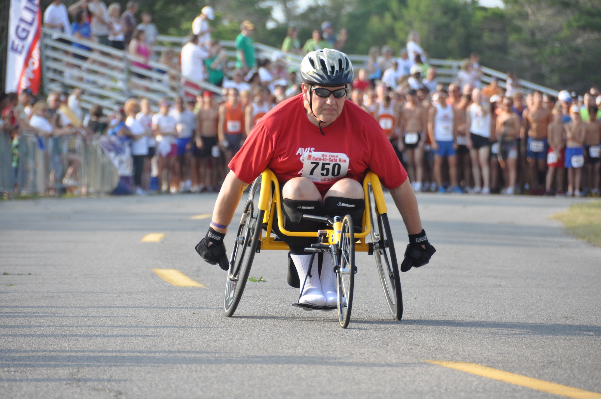 MacKey Tyndall, the sole competitor in the wheelchair division, received support from a cheering crowd of approximately 2,000 attendees during Eglin's annual Gate to Gate run honoring Memorial Day May 30. Mr. Tyndall finished the race just under 37 minutes; other results are listed on www.active.com, an event registration site the base used for the run. (U.S. Air Force photo/Chrissy Cuttita)