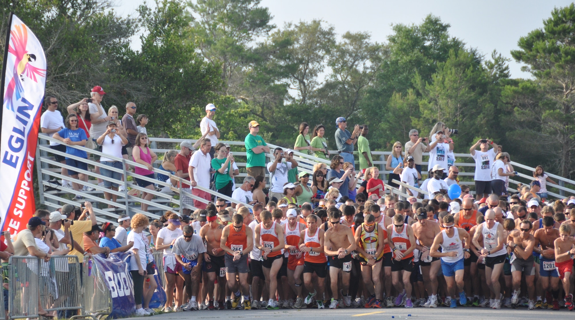 Runners ready and listen for the horn signaling the start of Eglin's 26th Annual Gate-to-Gate Run honoring Memorial Day. The base traditional event drew 1,939 participants to the starting line of the 4.4. mile race course May 30. Race results for divisions in wheelchair, running, walking and specific age groups are posted on www.active.com. (U.S. Air Force photo/Chrissy Cuttita).