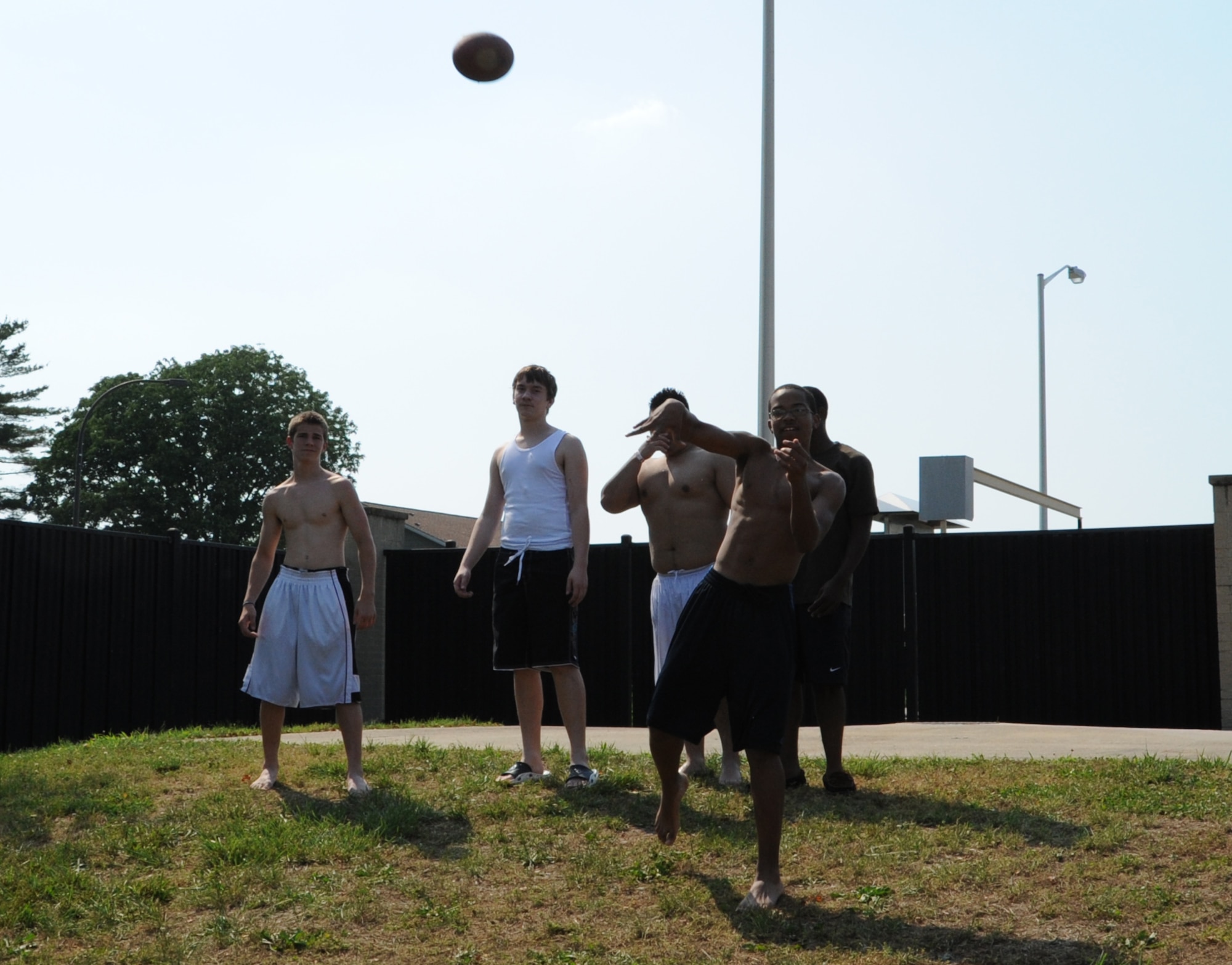Team Dover dependants play football at the Oasis Pool during adult swim May 30, 2011, at Dover Air Force Base, Del. (U.S. Air Force photo by Staff Sgt. Chad Padgett)