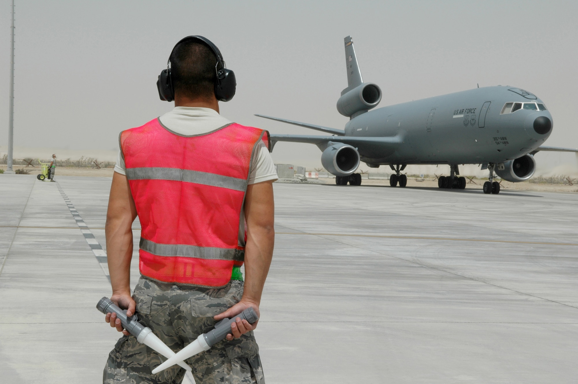 Airman 1st Class Gene Meredith prepares for the launch of a KC-10 Extender May 18, 2011, in Southwest Asia. Airman Meredith is a crew chief assigned to the 380th Expeditionary Aircraft Maintenance Squadron. (U.S. Air Force photo/Master Sgt. Julie Briden-Garcia)