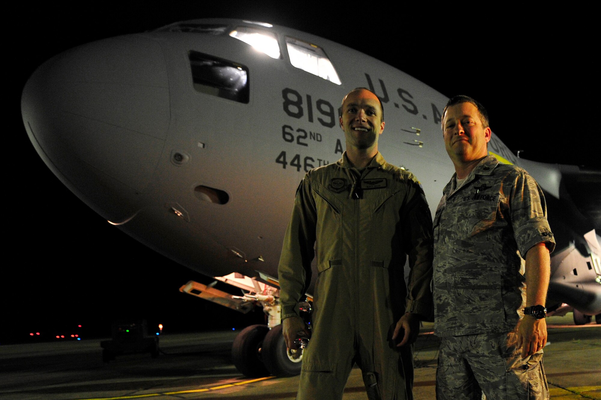 Capt. Matthew Read (left), 17th Airlift Squadron C-17 Globemaster III co-pilot greets his uncle Maj. Peter Mastroianni, 621st Contingency Response Element commander on the flightline of Mihail Kogalniceanu Air Base, Romania, May 22.  Uncle and nephew are both serving with the 385th Air Expeditionary Group while deployed here supporting an airfield runway closure in the region and a U.S. Transportation Command multi-modal proof-of-principle evaluation.  (U.S. Air Force photo by Master Sgt. Laura K. Deckman/released)