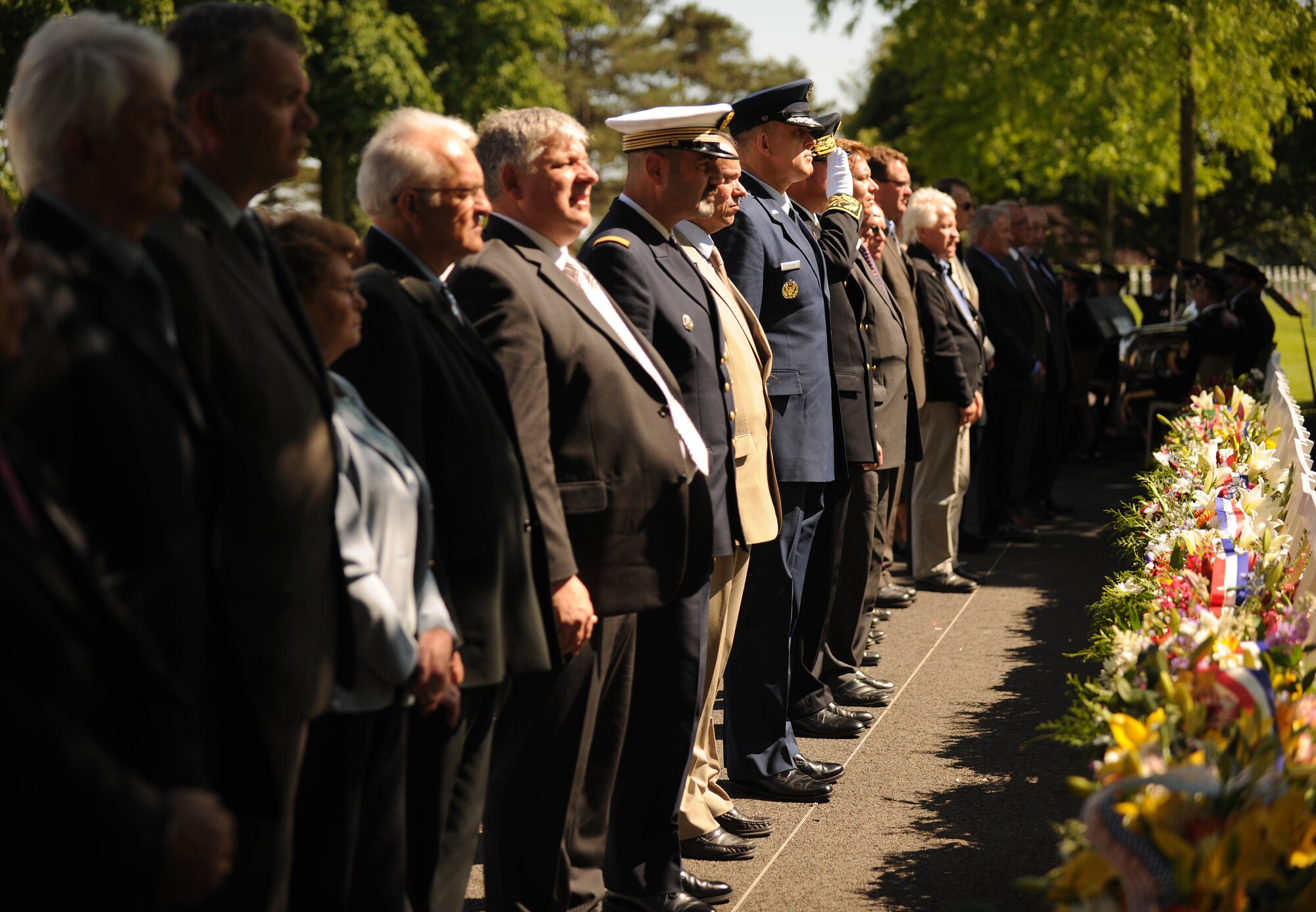 SAINT JAMES, France – Distinguished guests pause for a moment of silence after laying wreaths in honor of the fallen during a memorial ceremony at Brittany American Cemetery and Memorial in Saint James, France, May 29. Brittany American Cemetery is the final resting place for 4,410 U.S. service members who died during the Normandy and Brittany campaigns of World War II in 1944. (U.S. Air Force photo/Senior Airman Nathanael Callon)
