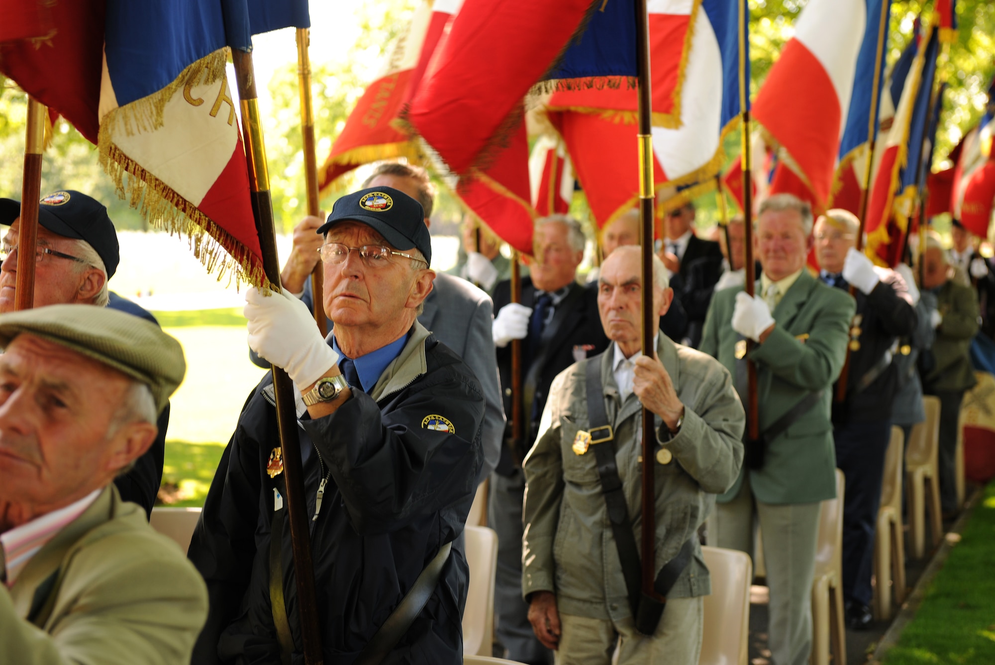 SAINT JAMES, France – French veterans stand for the presentation of the U.S. and French flags during a memorial ceremony at Brittany American Cemetery and Memorial in Saint James, France, May 29. Brittany American Cemetery is the final resting place for 4,410 U.S. service members who died during the Normandy and Brittany campaigns of World War II in 1944. (U.S. Air Force photo/Senior Airman Nathanael Callon)