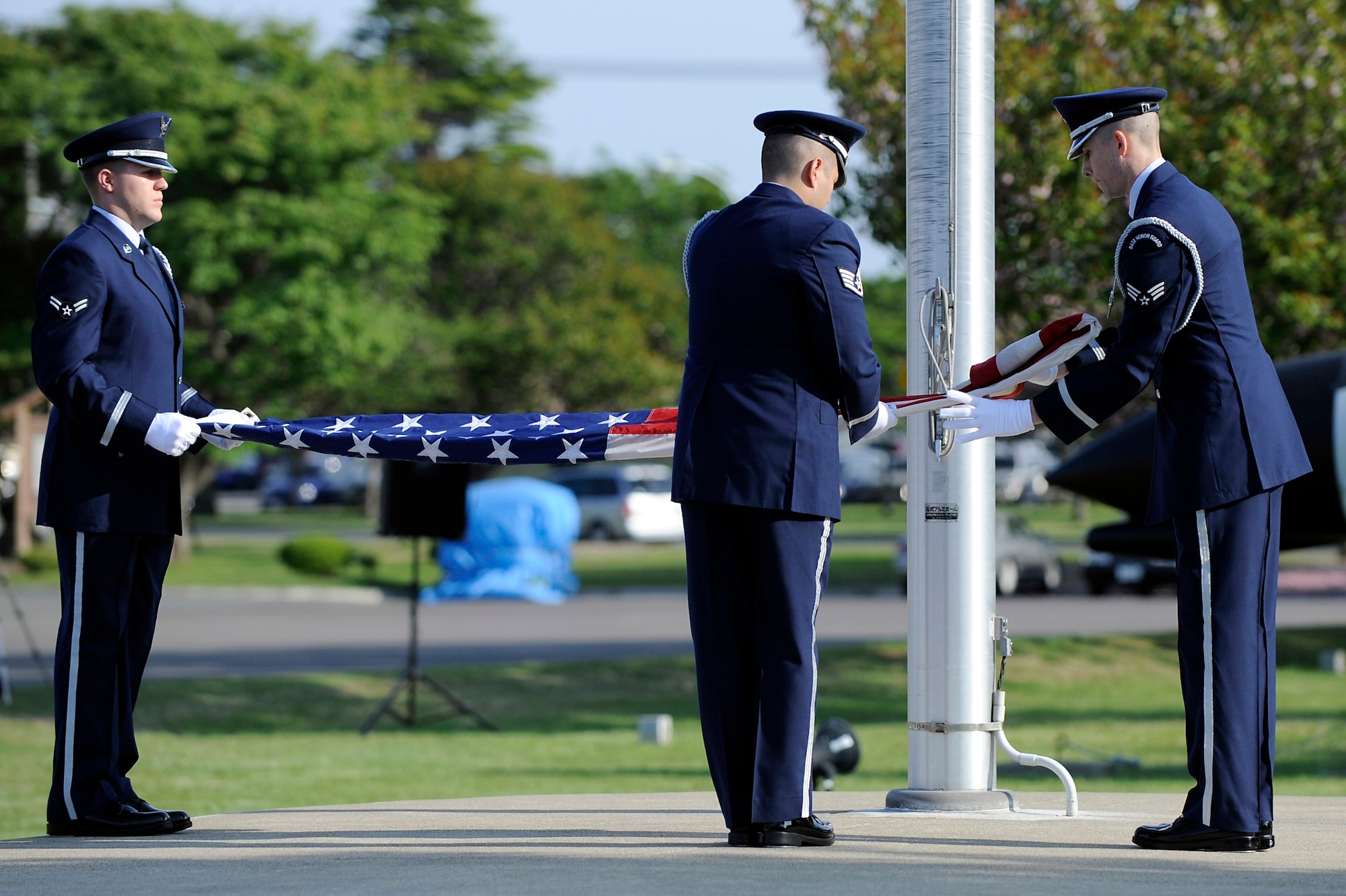 MISAWA AIR BASE, Japan -- Members of the base honor guard fold the American flag during a Memorial Day Retreat Ceremony at Risner Circle May 26. A national moment of remembrance takes place on the last Monday of May in observance of Memorial Day. (U.S. Air Force photo/Staff Sgt. Marie Brown/Released)