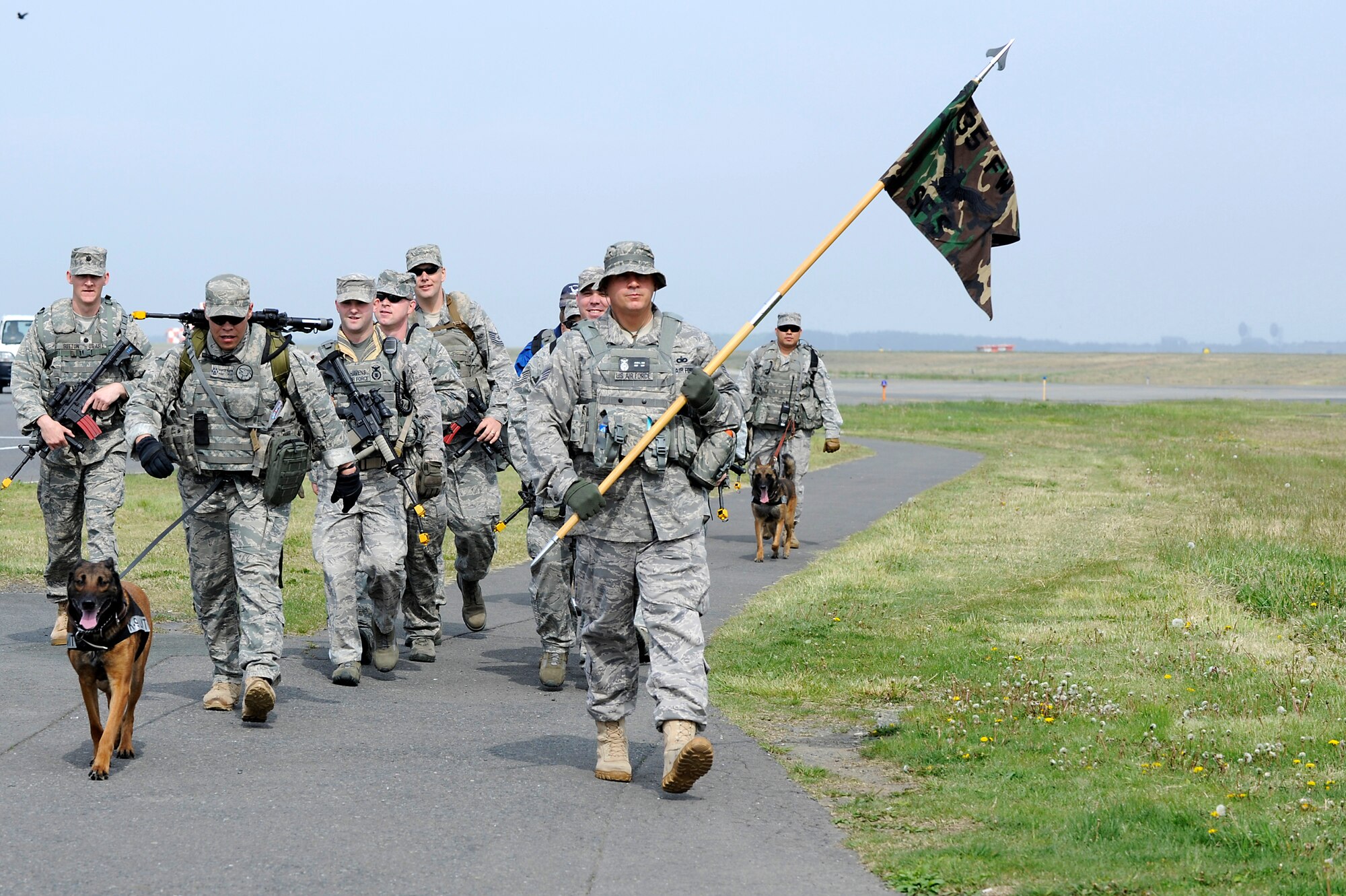 MISAWA AIR BASE, Japan -- Members of the 35th Security Forces Squadron walk the base perimeter in full gear May 27. The eight mile march was in honor of Memorial Day and those servicemembers who have been lost in the defense of their country. (U.S. Air Force photo/Staff Sgt. Marie Brown/Released)

