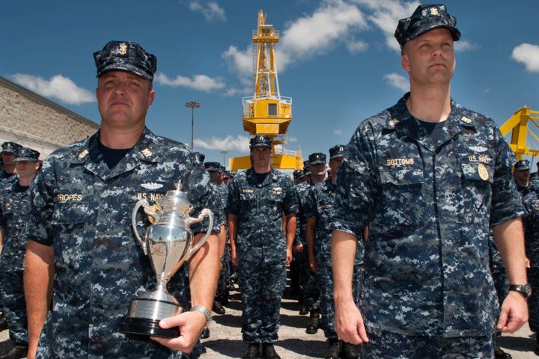 KINGS BAY, Ga. - Chiefs-of-the-boat Master Chief Missile Technician(SS) Terrence Propes (left) and Master Chief Fire Controls Technician(SS) Jeff Bottoms accept the 2010 Omaha Submarine Ballistic Missile Submarine Trophy on behalf of the crews of the Ohio-class ballistic missile submarine USS Rhode Island (SSBN 740) May 31 at Naval Submarine Base Kings Bay. Rhode Island was awarded the 2011 Omaha Submarine Ballistic Missile Trophy recognizing the Navy&#039;s best Trident submarine. (U.S. Navy photo by Mass Communication Specialist 1st Class(SW) James Kimber)
