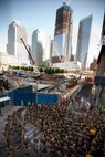 NEW YORK - Marines with the  24th Marine Expeditionary Unit, listen to their commander, Col. Frank Donovan, next to the Ground Zero construction site, May 31. Marines with the 24th Marine Expeditionary Unit led a run to Ground Zero. The majority of Marines with the 24th MEU joined the Marine Corps after the attacks of Sept. 11. More than 3,000 Marines, Sailors and Coast Guardsmen in the area participating in community outreach events and equipment demonstrations as part of Fleet Week New York 2011. This is the 27th year New York has hosted the sea services for Fleet Week. (Official Marine Corps photo by Cpl. Karim Delgado / RELEASED)::r::::n::::r::::n::