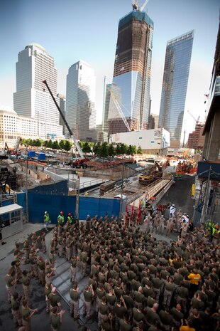 NEW YORK - Marines with the  24th Marine Expeditionary Unit, listen to their commander, Col. Frank Donovan, next to the Ground Zero construction site, May 31. Marines with the 24th Marine Expeditionary Unit led a run to Ground Zero. The majority of Marines with the 24th MEU joined the Marine Corps after the attacks of Sept. 11. More than 3,000 Marines, Sailors and Coast Guardsmen in the area participating in community outreach events and equipment demonstrations as part of Fleet Week New York 2011. This is the 27th year New York has hosted the sea services for Fleet Week. (Official Marine Corps photo by Cpl. Karim Delgado / RELEASED)::r::::n::::r::::n::