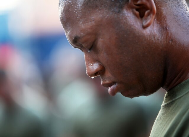 NEW YORK - A Marine with the  24th Marine Expeditionary Unit, bows his head and reflects in the shadow of the Ground Zero construction site,  May 31. Marines with the 24th Marine Expeditionary Unit led a run to Ground Zero. The majority of Marines with the 24th MEU joined the Marine Corps after the attacks of Sept. 11. More than 3,000 Marines, Sailors and Coast Guardsmen in the area participating in community outreach events and equipment demonstrations as part of Fleet Week New York 2011. This is the 27th year New York has hosted the sea services for Fleet Week. (Official Marine Corps photo by Lance Cpl. Michael Petersheim / RELEASED)