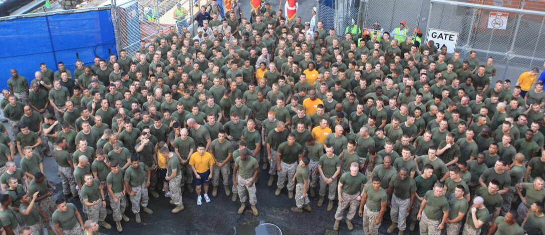 Marines and Sailors pose for a photo after a Ground Zero motivational run, which ended at the site of the World Trade Center, May 31, 2011. Various units from II Marine Expeditionary Force and Marines Forces Reserve have organized under the 24th Marine Expeditionary Unit to form the Special Purpose Marine Air Ground Task Force - New York. The Marines are embarking on the Navy’s Amphibious Assault Ships, the USS Iwo Jima (LHD -7) and USS New York (LPD-21) to take part in New York City's Fleet Week from May 25 to June 1, 2011. There, the Marines will showcase the capabilities of the MAGTF, and also honor those who have served by participating in a various of events during the Memorial Day weekend.