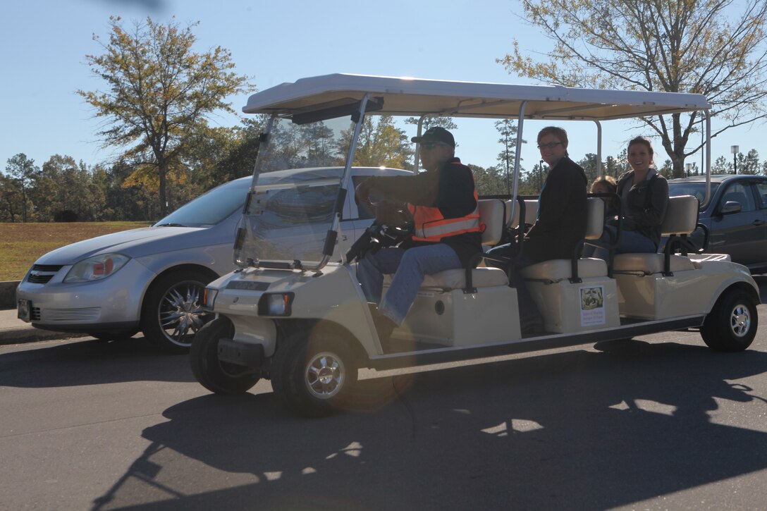 Luis Minguela, lead shuttle driver, assists patients to their vehicles at Naval Hospital Camp Lejeune aboard Marine Corps Base Camp Lejeune, Nov. 1.