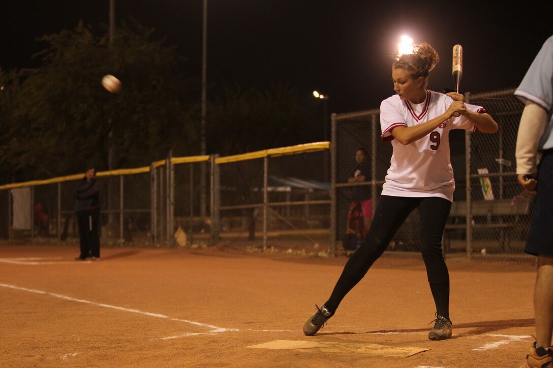 Drama Killers’ catcher Alexis Hunter  watches the ball as it comes to the plate in a game against Outkast in the Co-ed Softball League Nov. 1, 2011.