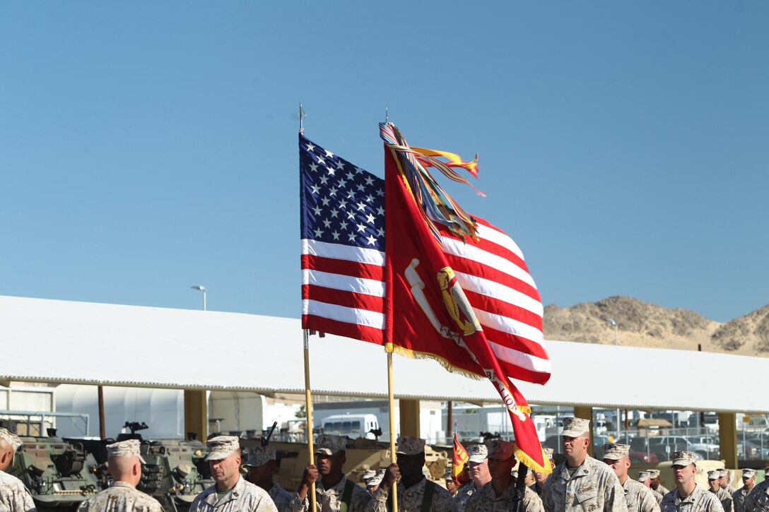 The new battle streamers fly in the wind during the rededicated battle colors of 1st Tank Battalion at the battalion’s tank ramp Oct. 26, 2011.