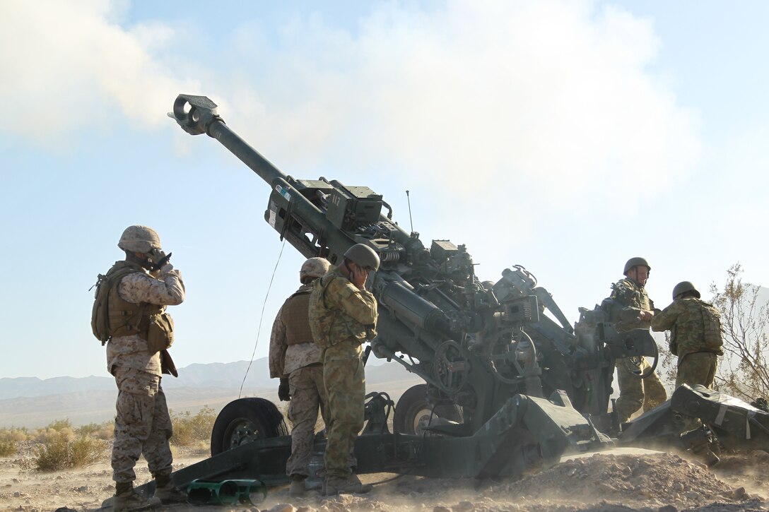 Marines of Gun Six,  Battery L, 3rd Battalion, 11th Marine Regiment work with soldiers of the Australian Army to fire the M777 A2 Howitzer during the Golden Eagle exercise held at Lead Mountain training area Nov. 1, 2011.