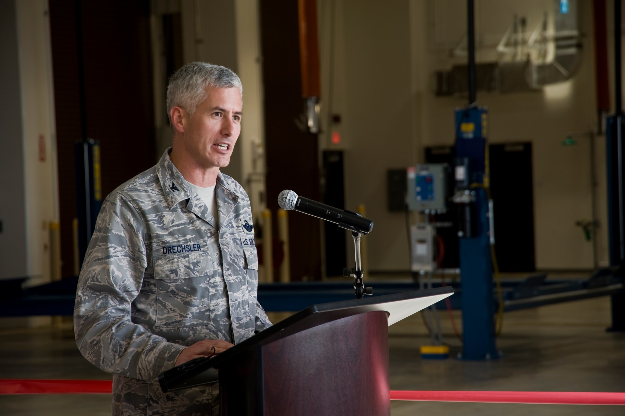 Col.  Donald Drechsler, 36th Wing vice commander, gives a few remarks prior
to the ribbon cutting ceremony held for the Combat Support Vehicle
Maintenance Facility at Northwest Field here Oct. 26.  The new maintenance
building is used as a joint facility intended to support the units now
relocating to Northwest Field Expeditionary Combat Support campus. It is
designed for the primary use of the 554th Red horse Squadron which operates
and maintains more than 400 pieces of heavy civil and building construction
vehicles. (U.S Air Force photo by Staff Sgt. Alexandre Montes/ RELEASED)
