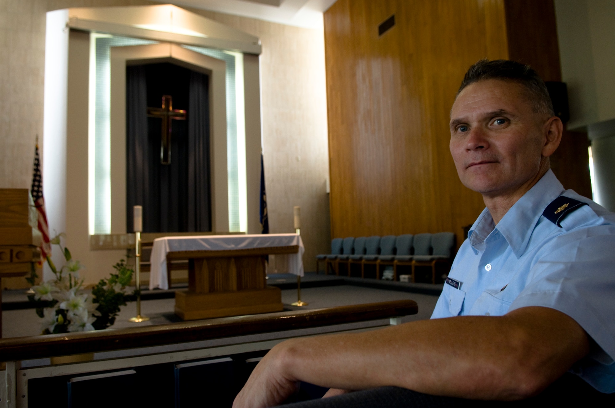 U.S. Air Force Chaplain (Maj.) Randy Sellers, 18th Wing deputy wing chaplain, sits in the front pew of Chapel 2 on Kadena Air Base, Japan, Oct. 31. Sellers was selected, along with 17 other individuals from around the Air Force, for the 2011 "Portraits in Courage," an Air Force publication that highlights individuals for courageous service. (U.S. Air Force photo/Airman 1st Class Maeson L. Elleman/released)