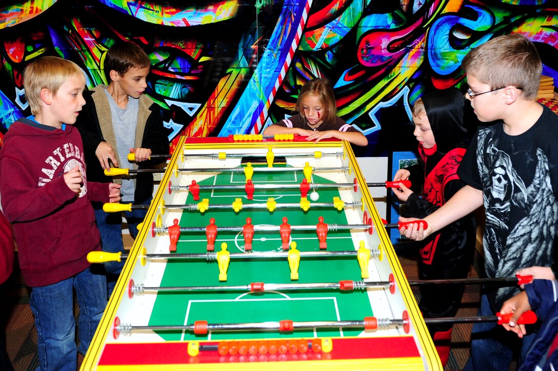 Children participate in one of several games offered at the Family Fall Fest at Langley Air Force Base, Va., Oct.28, 2011. The fest is a new event sponsored by the Langley Youth Program for Joint Base Langley-Eustis dependants. (U.S. Air Force photo by Airman 1st Class Kayla Newman/Released) 