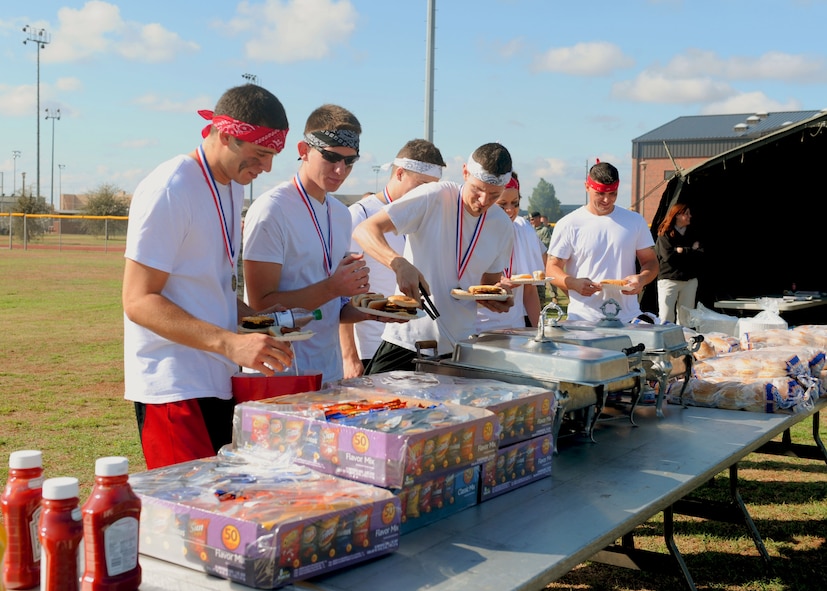 Members from the 7th Component Maintenance Squadron fill up their plates Oct. 28, 2011, at Dyess Air Force Base, Texas. Many events were being held at Dyess to include olympics, a battle dress uniform bash and burger burn for all squadrons to participate and compete in. (U.S. Air Force photo by Airman 1st Class Cierra Bullock/ Released)
