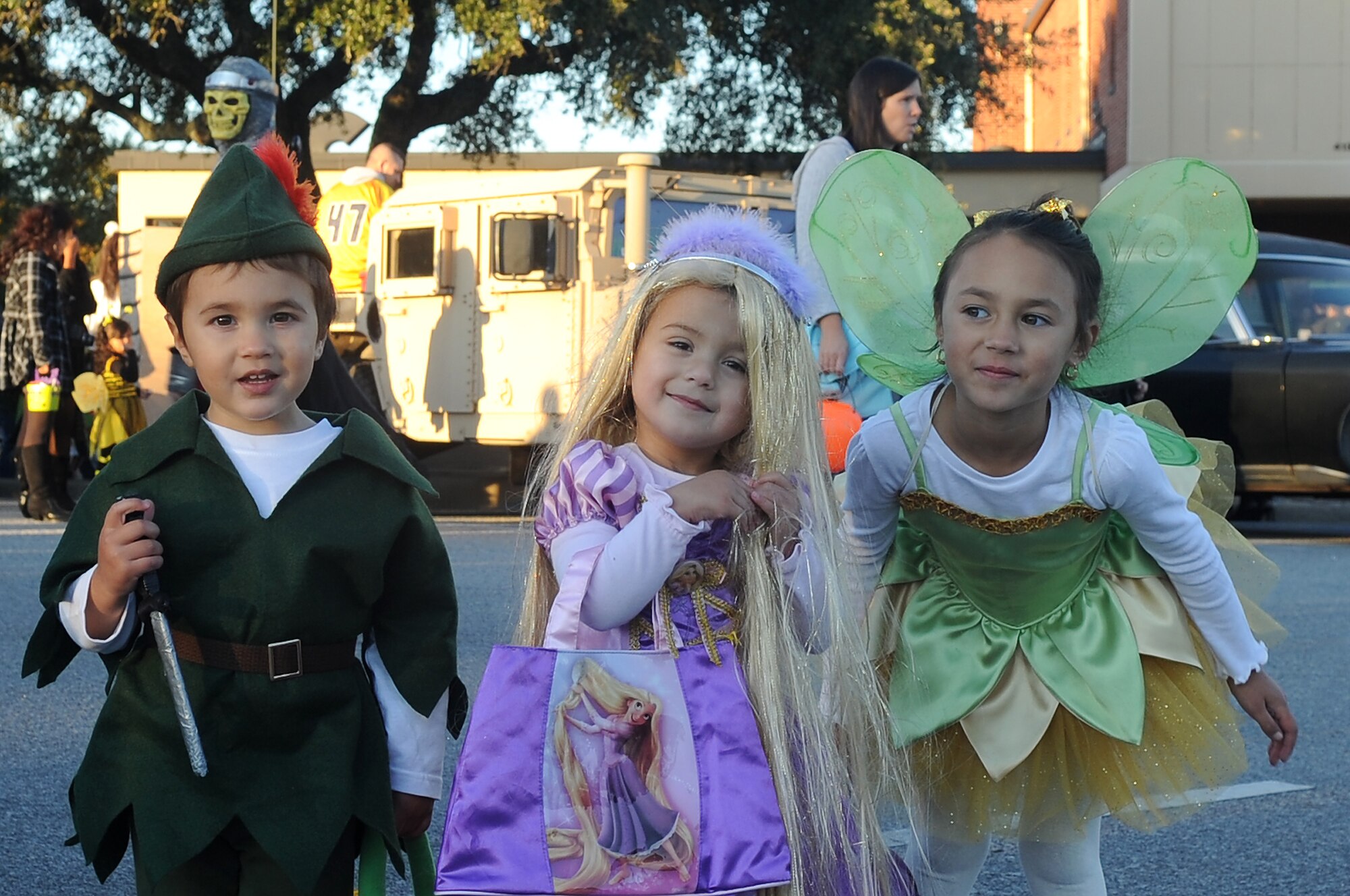 Local children (from left) Wyatt Cathcart, Kadence Mahmoud, and Payton Cathcart, enjoy Shaw?s Halloween celebration, Boo Bash, with their families at Shaw Air Force Base, S.C., Oct. 29, 2011. The Boo Bash is held annually for military families to enjoy the festivities. (U.S. Air Force photo by Airman First Class Hunter Brady/Released)



