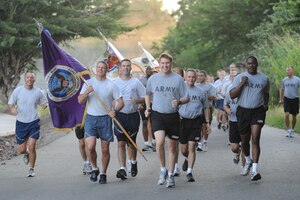 Joint Task Force-Bravo leadership leads the base in a formation run to kick off JTF-Bravo Organization Day Oct. 26, 2011, at Soto Cano Air Base, Honduras. Honduran military members along with U.S. Soldiers, Airmen, Sailors and Marines participated in various sports to include soccer, volleyball, basketball, flag football, dodgeball and more. (U.S. Air Force photo/Tech. Sgt. Matthew McGovern)