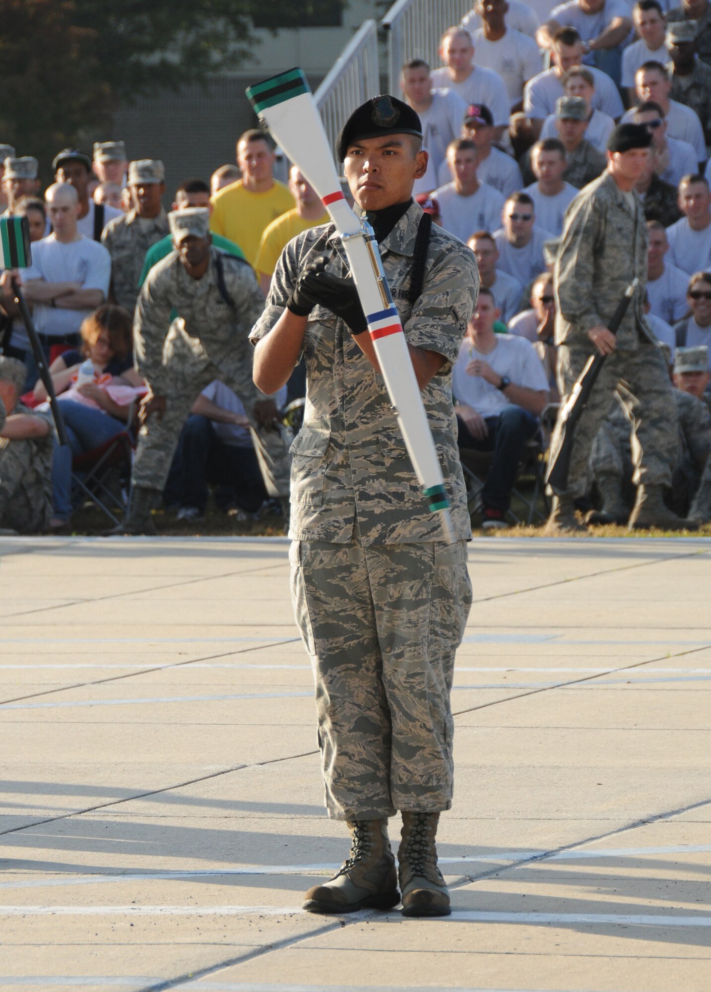 Airman Joseph Viray, 334th Training Squadron freestyle drill master, spins a rifle during the freestyle drill team performance Oct. 28, 2011, at Keesler Air Force Base, Miss.  The Gators swept the quarterly drill down competition placing first in each category as well as being named the overall winners.  This is the final drill down for the season.  (U.S. Air Force photo by Kemberly Groue)