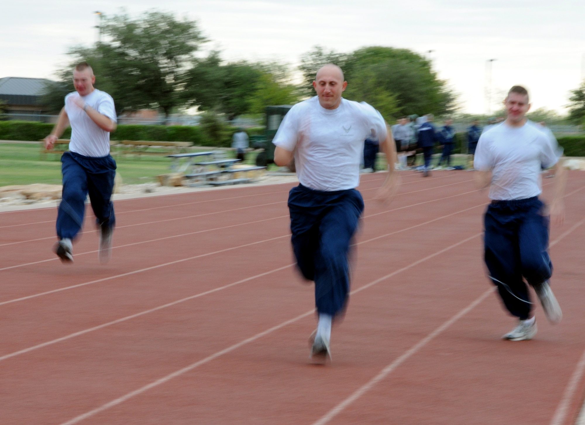 GOODFELLOW AIR FORCE BASE, Texas--  Airmen compete in early-day 100 meter dashes to see who will represent each team during the competitions later in the day. (U.S. Air Force photo/Airman 1st Class Jessica Keith)