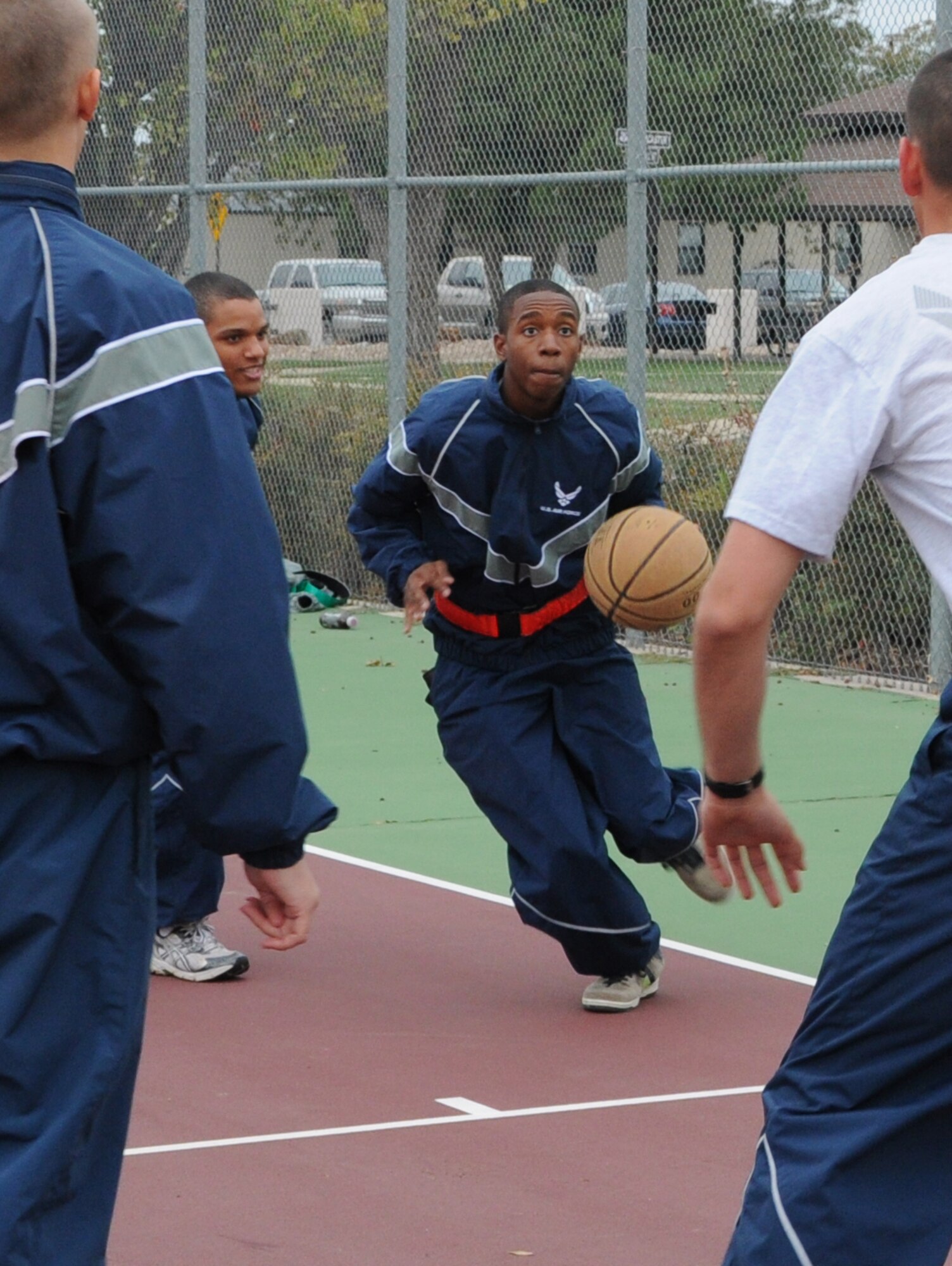GOODFELLOW AIR FORCE BASE, Texas—Airmen from the 312th Training Squadron enjoy a game of basketball during the quarterly Sports Day, Oct. 28. Throughout the half-day event, Mathis Fitness Center hosted more than a dozen different sports games including, football, racquet ball and kickball. The final event was an obstacle course, which the top scoring teams used to compete for first place. (U.S. Air Force photo/Airman 1st Class Jessica Keith)