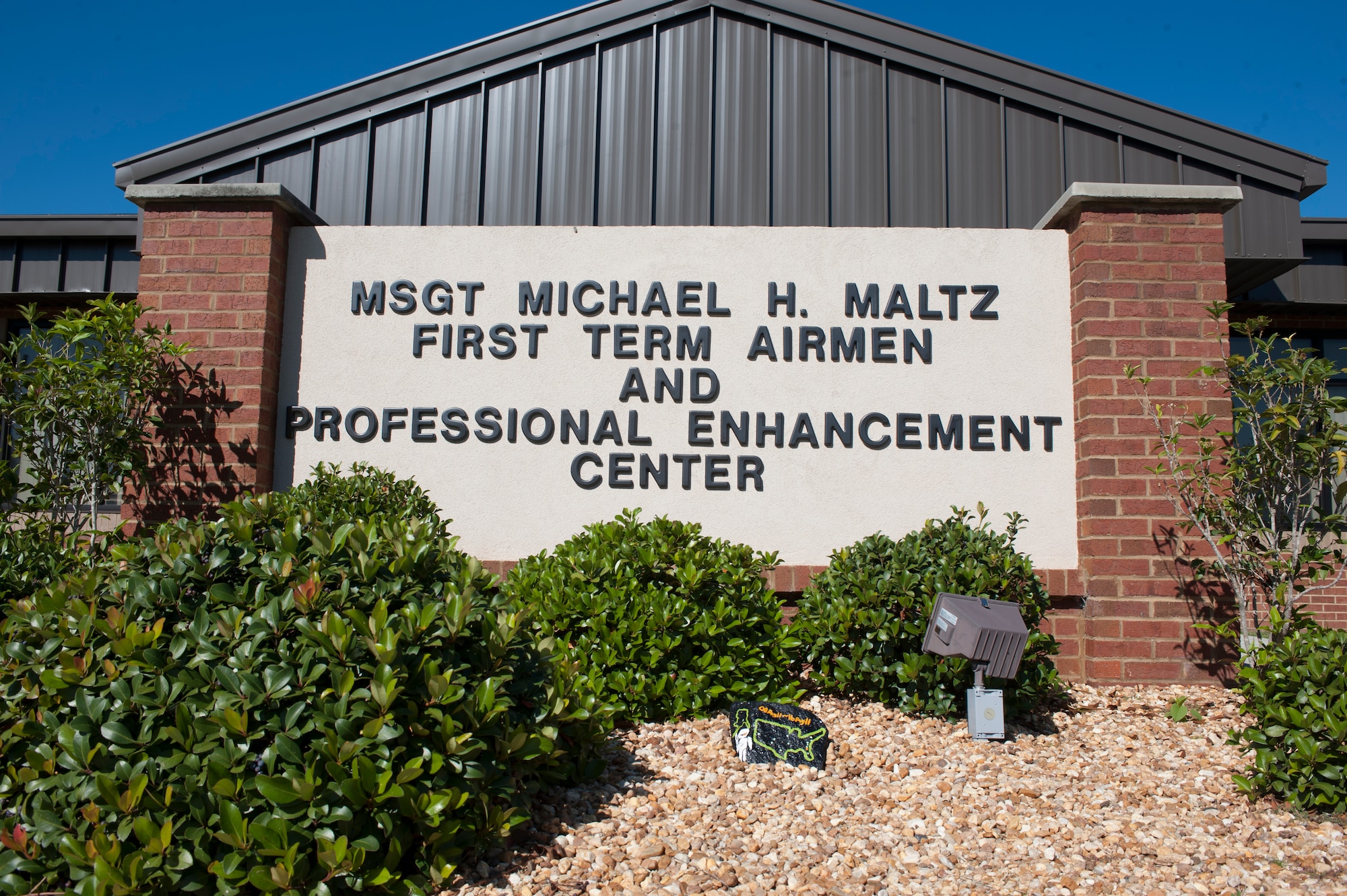A sign in front of the First Term Airmen and Professional Enhancement Center shows the name of U.S. Air Force Master Sgt. Michael Maltz, a pararescueman who died in an HH-60G Pave Hawk crash while on a rescue mission in Afghanistan. Kyle Maltz, Sergeant Maltz’s son, last visited Moody Air Force Base, Ga., in 2008 when the center was dedicated to his father. (U.S. Air Force photo by Airman 1st Class Jarrod Grammel/Released)
