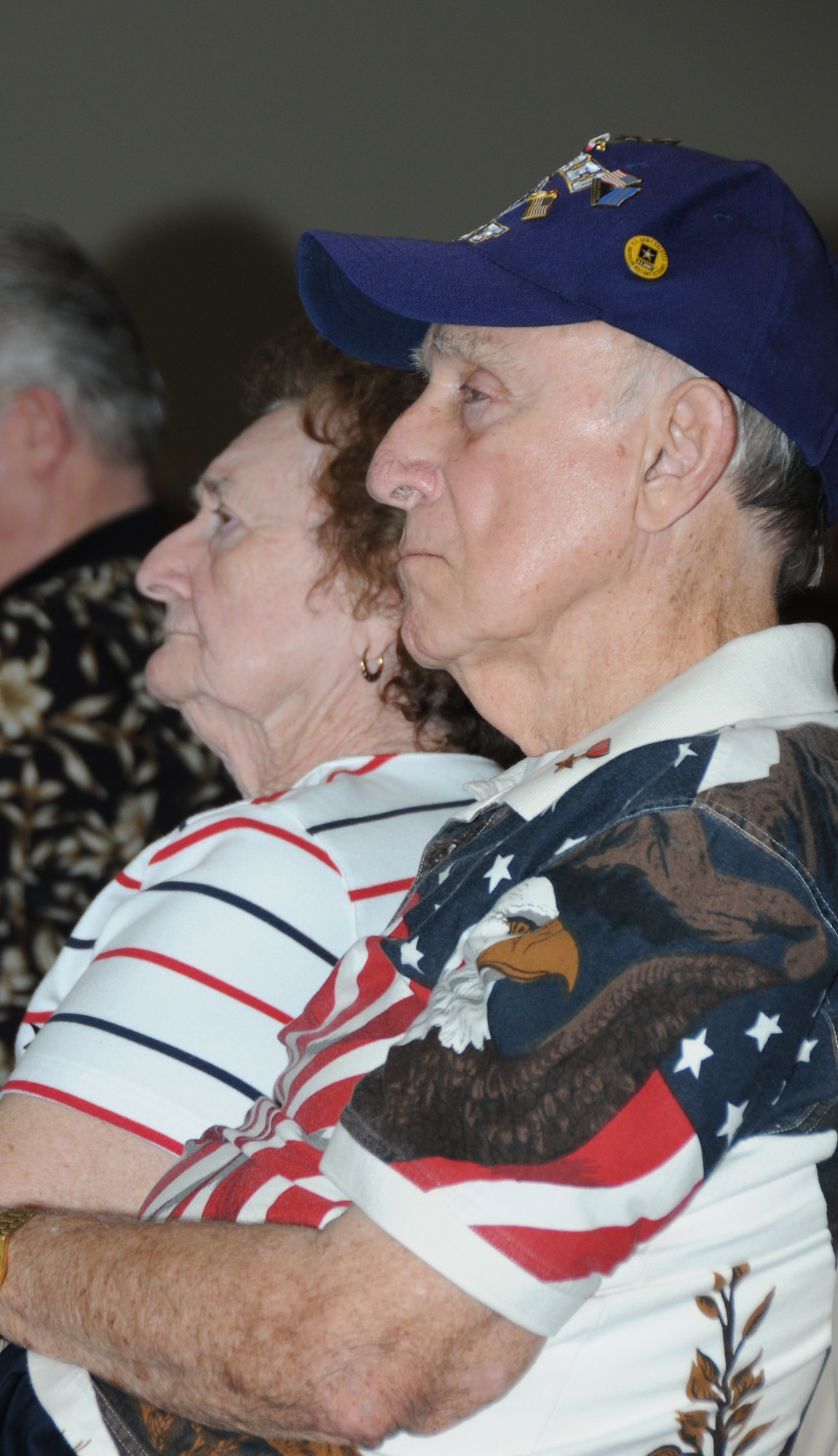 Betty and Charles Martin, a retired Air Force member from Biloxi, Miss., listen to the guest speaker, Mike Plumer, deputy legislative director of the National Associations for Uniformed Services during Retiree Appreciation Day Oct. 28, 2011, at the Roberts’ Consolidated Aircraft Maintenance Facility at Keesler Air Force Base, Miss.  The annual event included a guest speaker, door prizes, more than 30 displays with information pertinent to retirees and a free lunch.  (U.S. Air Force photo by Kemberly Groue)